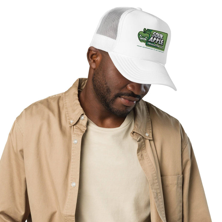 Man wearing a white Sour Apple Foam Trucker Hat with green apple logo, suitable for sports fans and casual fashion.
