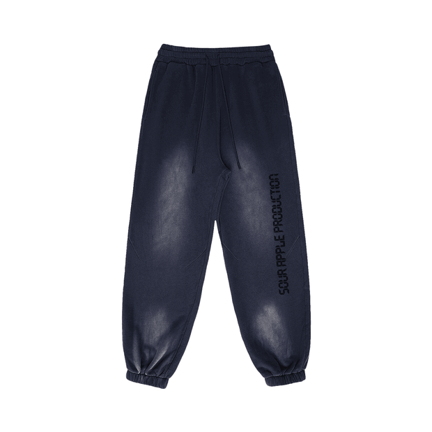 Navy blue Sour Apple men's heavyweight athleisure sweatpants with a sun faded effect and elastic cuffs, featuring a relaxed fit and side branding.