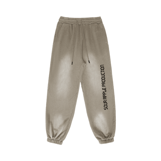 Beige Sour Apple men's heavyweight athleisure sweatpants with a sun faded design, elastic waistband, and oversized fit for casual streetwear style.