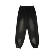 Black Sour Apple men's heavyweight athleisure sweatpants with a sun faded finish, relaxed fit, and elastic waistband for a lived in streetwear vibe.